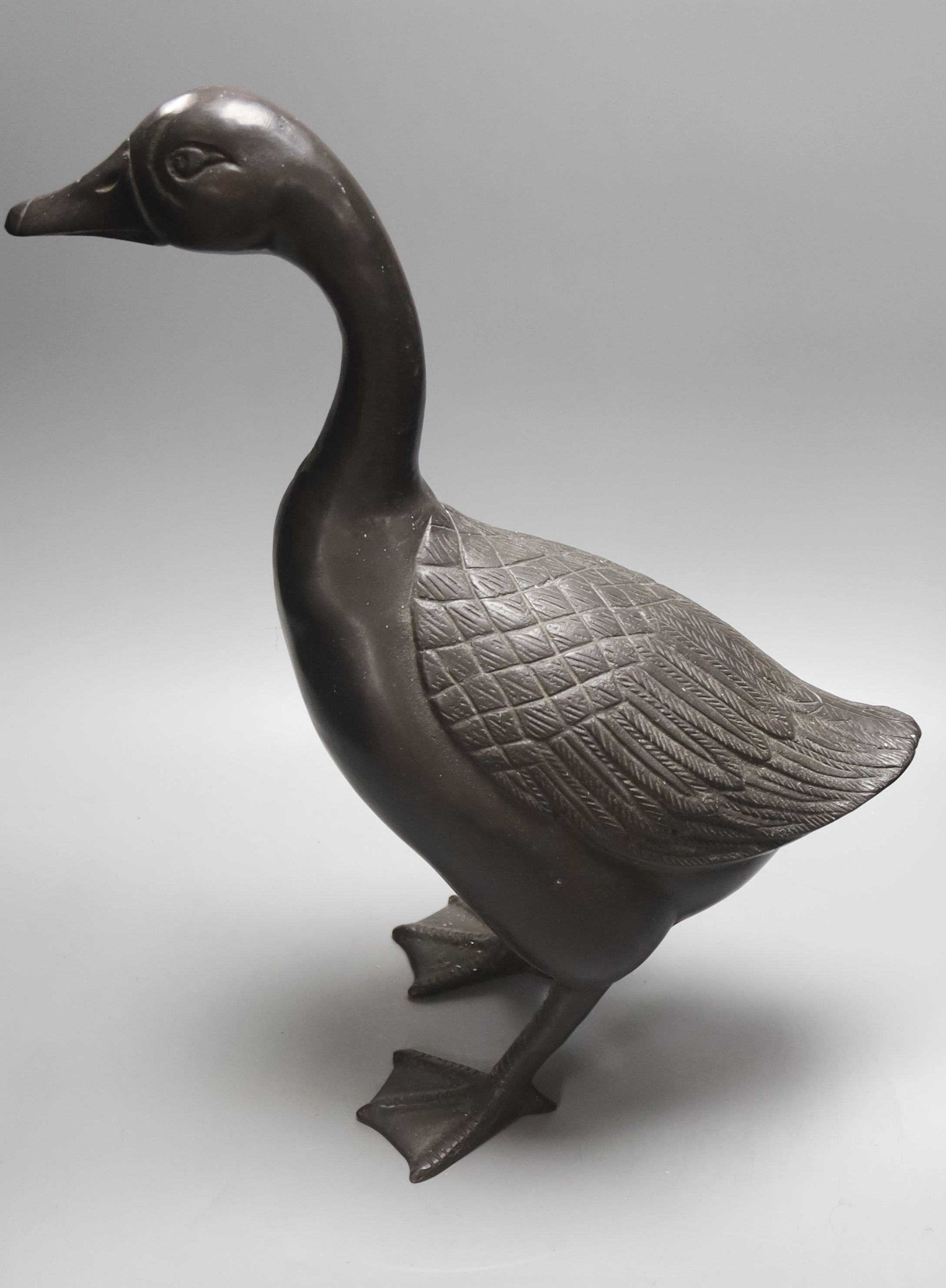 A pair of modern Chinese bronze models of geese, largest 48cm